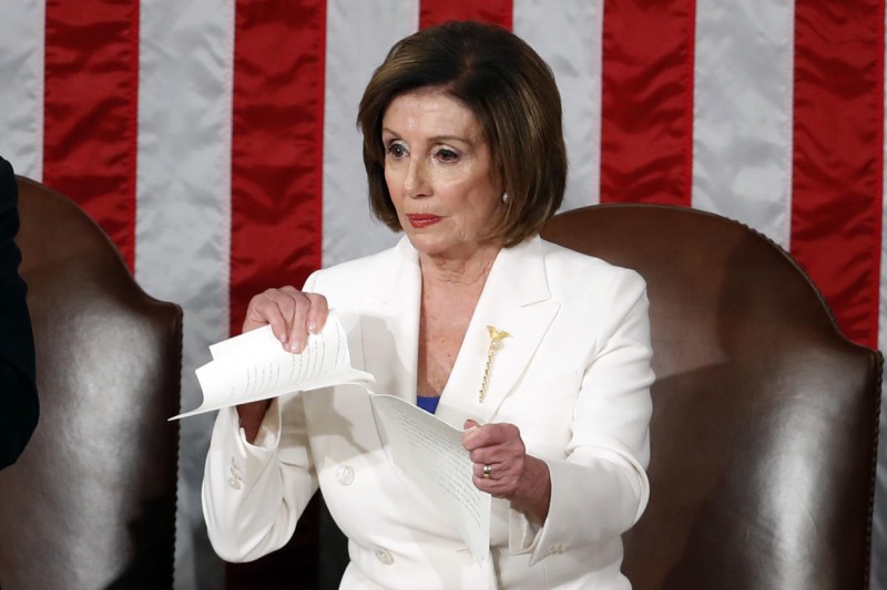 Former House Speaker Nancy Pelosi tears up her copy of President Donald Trump's State of the Union address after he delivered it to a joint session of Congress on Capitol Hill in 2020. 