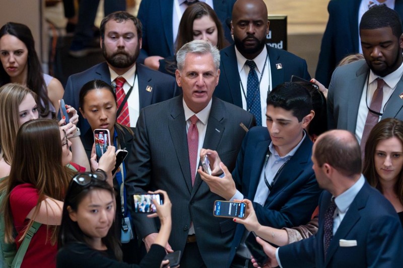 Reporters encircle Speaker of the House Kevin McCarthy, R-Calif., as debt limit negotiations continue, at the Capitol in Washington, Thursday, May 25, 2023. McCarthy adjourned the House for the Memorial Day weekend.