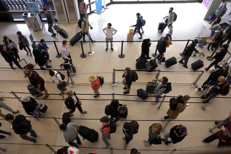 Travelers line up to enter a security checkpoint at San Francisco International Airport on July 1, 2022 in San Francisco, California. Justin Sullivan/Getty Images