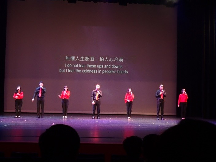 A group of people on a stage

Description automatically generated