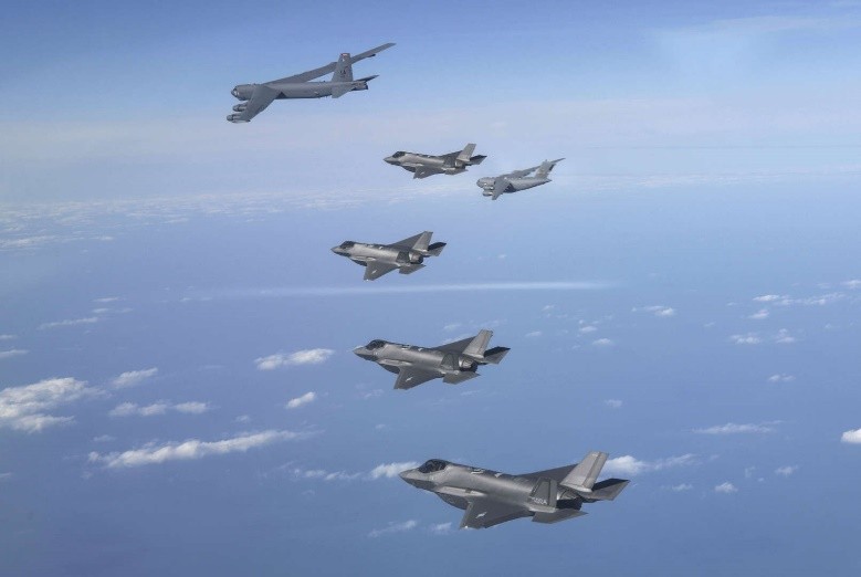 A group of jets flying in formation

Description automatically generated with medium confidence
