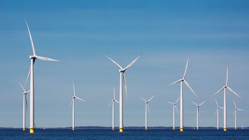 A group of wind turbines in the water

Description automatically generated with medium confidence