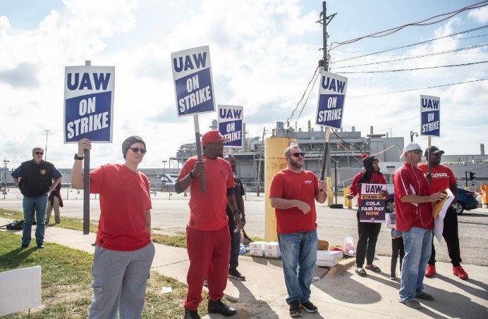 UAW union members picket outside the Ford Michigan Assembly Plant in Wayne, Michigan, on September 15, 2023.  / Credit: MATTHEW HATCHER/AFP via Getty Images